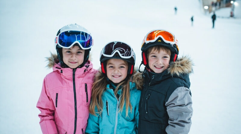 Children wearing helmets and ski gear smiling inside a large indoor snow park in Shenzhen